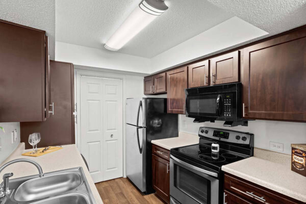 sw-lp-kitchen upgraded kitchen with stainless steel appliances and espresso colored cabinets